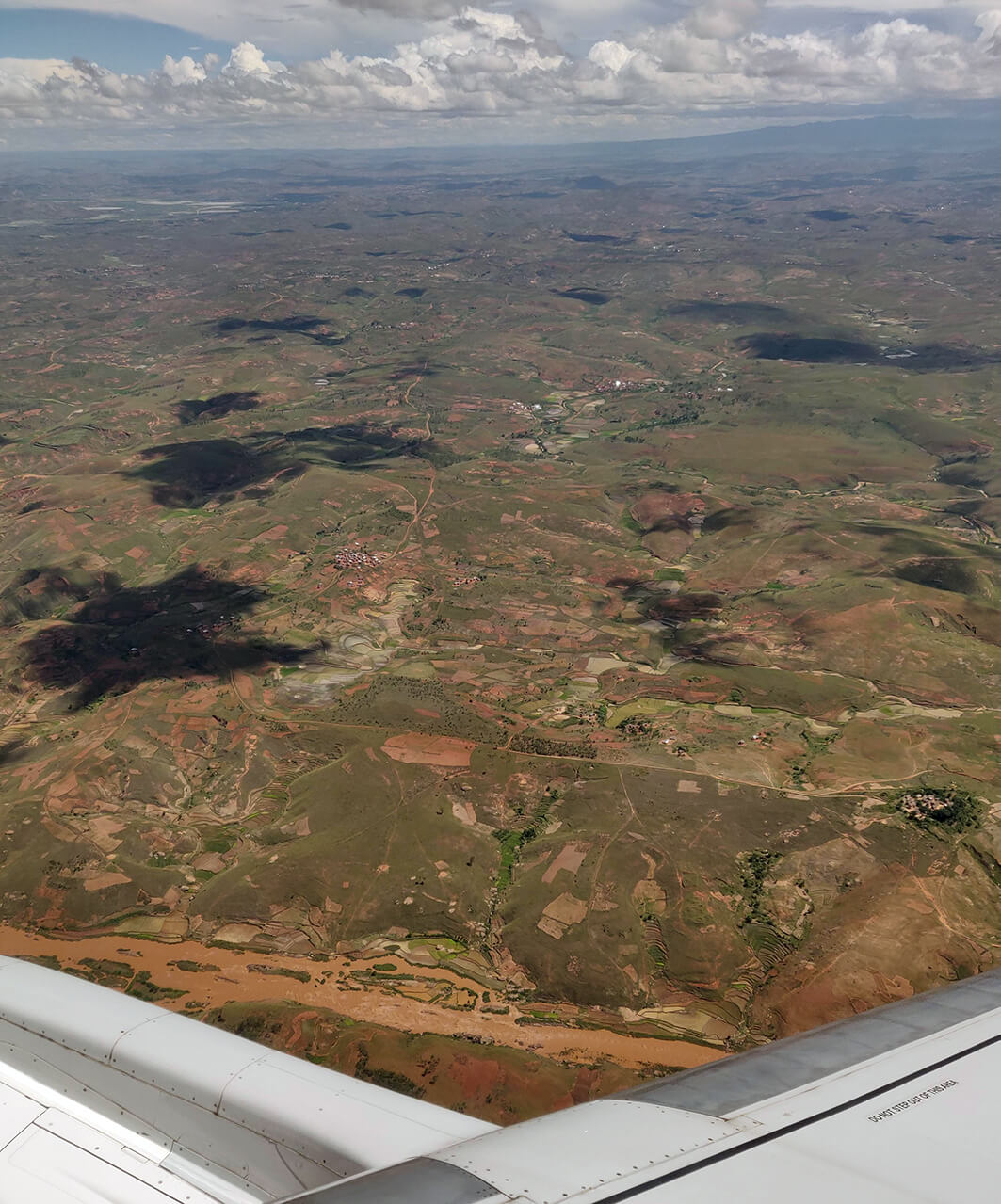 The land looks eroded, and the rivers are red with top-soil