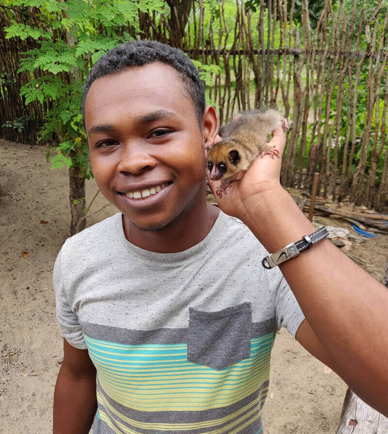 Daniel poses with Chip, chip barely fills Daniel's hand