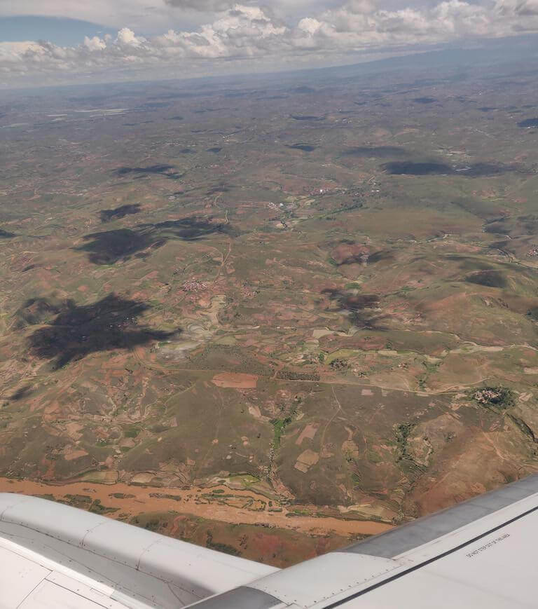 The flight into Tana afforded views of scarred lands, and muddy rivers