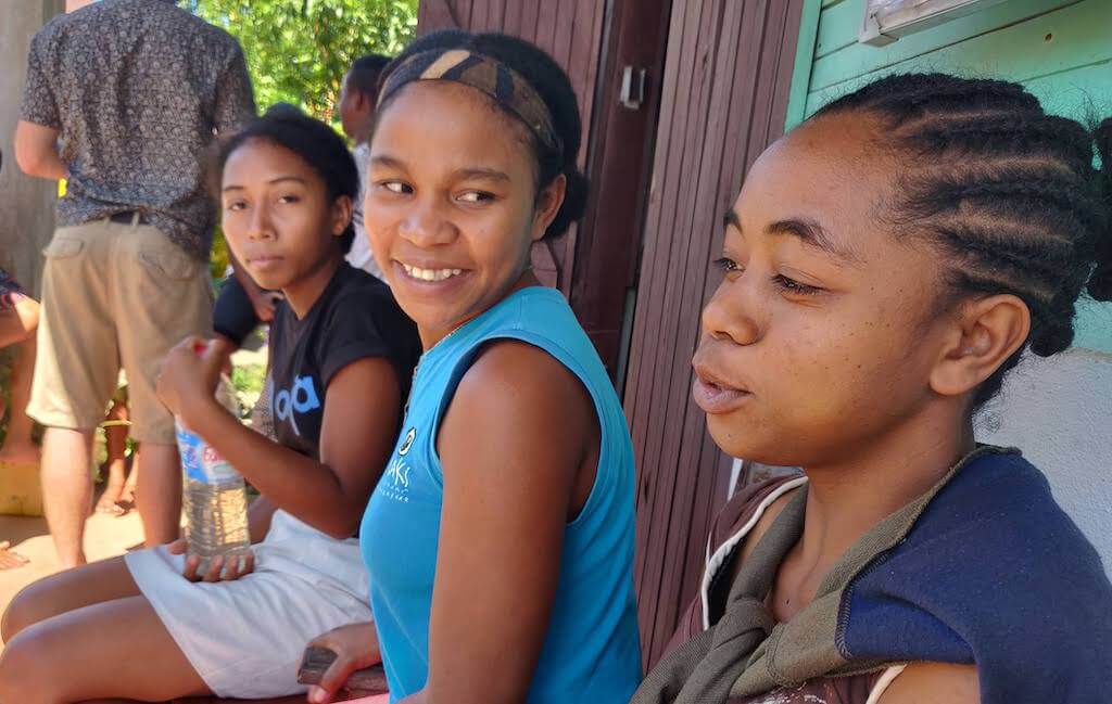 Sandy, Prisca, and Sarah debating.