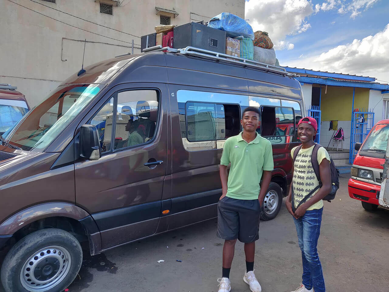 Julio and Kevin in front of the Mini-bus taxi